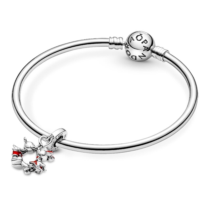 A silver-colored bracelet with a charm attached to it.