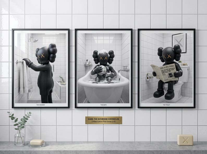 May include: A set of three framed prints titled KAWS: THE BATHROOM CHRONICLES. Each print features a black KAWS character in a white tiled bathroom setting: one in the shower, one in a bathtub, and one sitting on a toilet reading a newspaper.