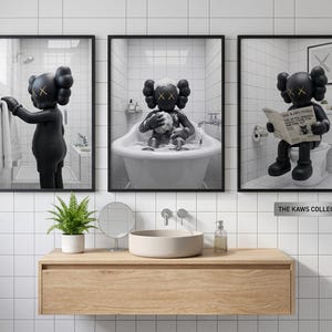 May include: A set of three framed wall art prints featuring a black KAWS character in a white-tiled bathroom. The left print shows the character reaching for a towel, the center shows it in a bathtub, and the right shows it reading a newspaper.