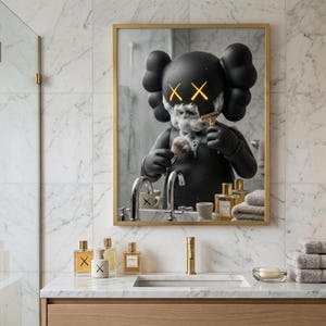 May include: A rectangular wall mirror with a gold frame reflecting a black cartoon character with X-shaped eyes covered in shaving foam. The character holds a shaving brush and razor. The bathroom vanity below features glass perfume bottles and towels.