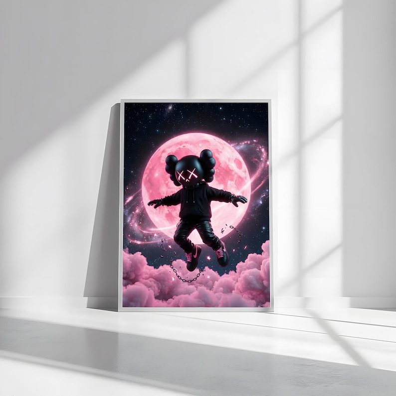 May include: Framed art print showing a black figure with 'XX' eyes, against a pink moon and clouds. The figure wears a black hoodie, trousers, and shoes, with a chain. The background is a starry night sky, creating a surreal scene.