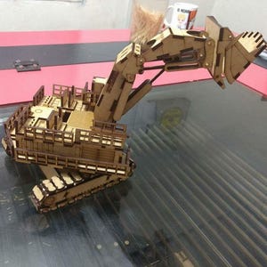 May include: A rustic wooden sign with the text "Welcome to our home" in white lettering. The sign features a distressed finish and a simple, inviting design, perfect for a front porch or entryway.