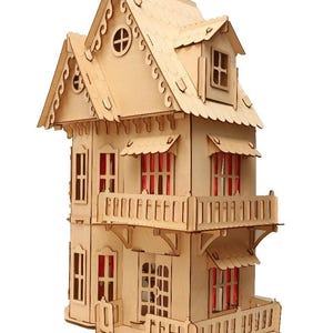 May include: A wooden dollhouse with multiple stories, balconies, and a detailed roof. The windows have red curtains, and the house is constructed from light-colored wood. The design includes decorative trim and a small front porch.
