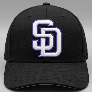 May include: A black baseball cap featuring the embroidered white and blue interlocking letters "SD". The cap has a curved brim and a button on top. The hat is a classic style, suitable for sports fans.