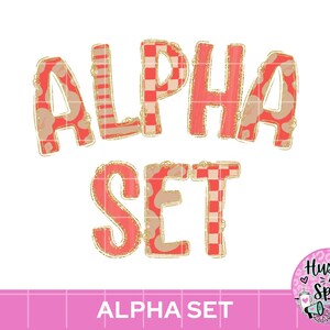 May include: The text ALPHA SET is displayed in a bold, rounded font with a coral and beige color scheme. The letters feature various patterns including stripes, checkers, and animal print, all outlined in a thin, gold-colored border.