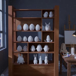 May include: A wooden shelf displays an assortment of white ceramic Easter decorations. The collection includes eggs with various patterns, bunnies, chicks, and other figurines. The shelf is in a room with a window and a table.