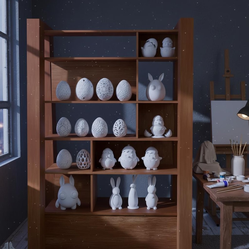 May include: A wooden shelf displays an assortment of white ceramic Easter decorations. The collection includes eggs with various patterns, bunnies, chicks, and other figurines. The shelf is in a room with a window and a table.