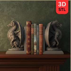 May include: A pair of dragon bookends in a gray finish flank a row of books on a wooden shelf. The dragon sculptures have detailed wings and scales. The books have various colors and designs, with the text "3D STL" in the upper right corner.