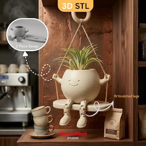 May include: A cream-coloured hanging planter shaped like a round character with a smiling face, articulated legs, and a green air plant. The planter sits on a small swing suspended by ropes. Text includes 3D STL, 2 Piece Design, and Articulated legs.