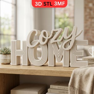 May include: A cream-colored decorative sign that spells out "Cozy Home" in a stylized font. The word "Home" has vertical and horizontal lines. A small succulent plant in a pot and books are also visible.