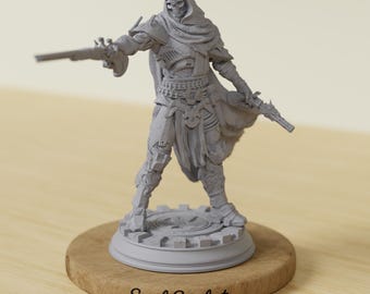 May include: A gray figurine of a hooded figure with a skull face, holding two flintlock pistols. The figure is standing on a circular base, which is mounted on a wooden stand. The text "Soul Sculpt" is printed on the wooden base.