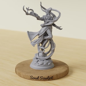 May include: A grey resin figurine of a standing figure with flowing robes and outstretched arms, mounted on a circular wooden base with the text Soul Sculpt engraved on the front. The figure features intricate details on the clothing and base.