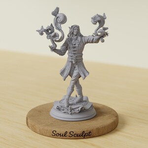 May include: A gray figurine of a person with long hair and a detailed outfit, holding swirling shapes with butterflies and fish. The figurine is on a wooden base with the text "Soul Sculpt".
