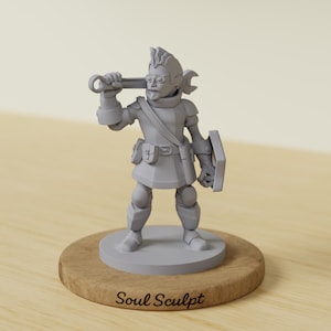 May include: A gray figurine of a character holding a wrench and shield, standing on a wooden base. The figurine is wearing armor and glasses. The base has the text "Soul Sculpt".