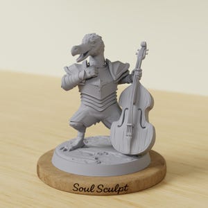 May include: A gray figurine of a bird-like creature in armor, holding a double bass. The sculpture is mounted on a wooden base with the text "Soul Sculpt". The figure is in a dynamic pose, suggesting movement.