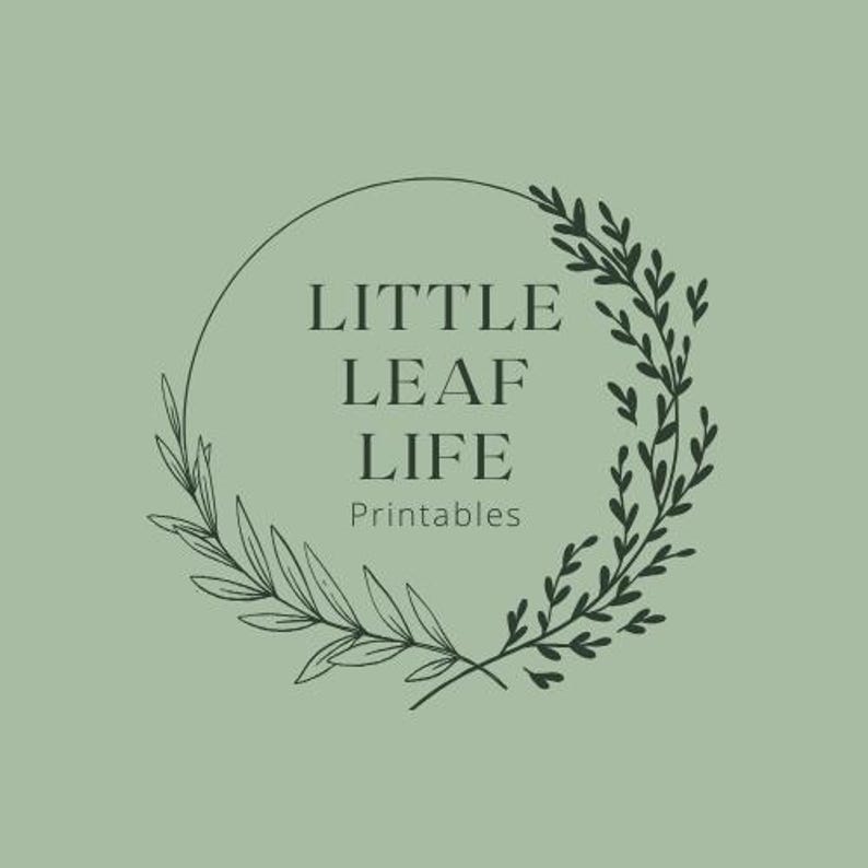 May include: A logo design featuring the text "LITTLE LEAF LIFE Printables" in a serif font, encircled by a dark green botanical wreath on a light green background. The wreath is composed of delicate leaves and branches.