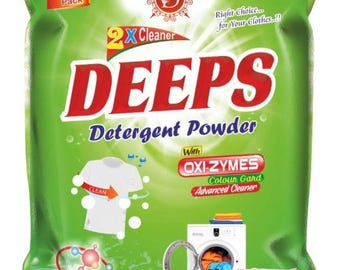 May include: A green bag of DEEPS Detergent Powder with red and white text. The bag features illustrations of a clean white t-shirt, a washing machine, and a stack of folded clothes. The text includes "2X Cleaner" and "OXI-ZYMES".