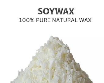 May include: A pile of white soy wax flakes with the text SOYWAX 100% PURE NATURAL WAX printed above it. The wax consists of small, irregular, solid pieces that are opaque and off-white in color, forming a conical mound against a white background.