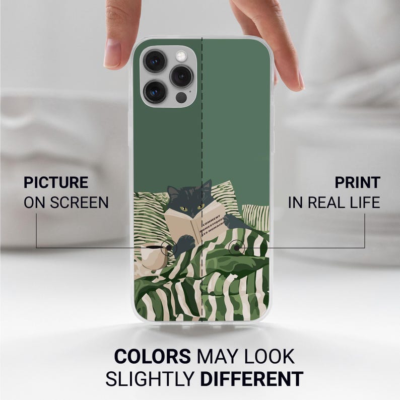 May include: A phone case featuring a black cat reading a book while lying in bed. The design includes green and white striped bedding and pillows. The text on the case reads "Picture on Screen" and "Print in Real Life."