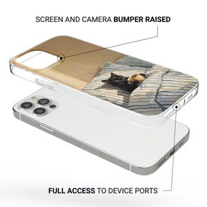 May include: Clear iPhone case with a printed design of a black cat and a tan cat sleeping under a striped blanket. The case has raised edges for screen and camera protection and full access to device ports.