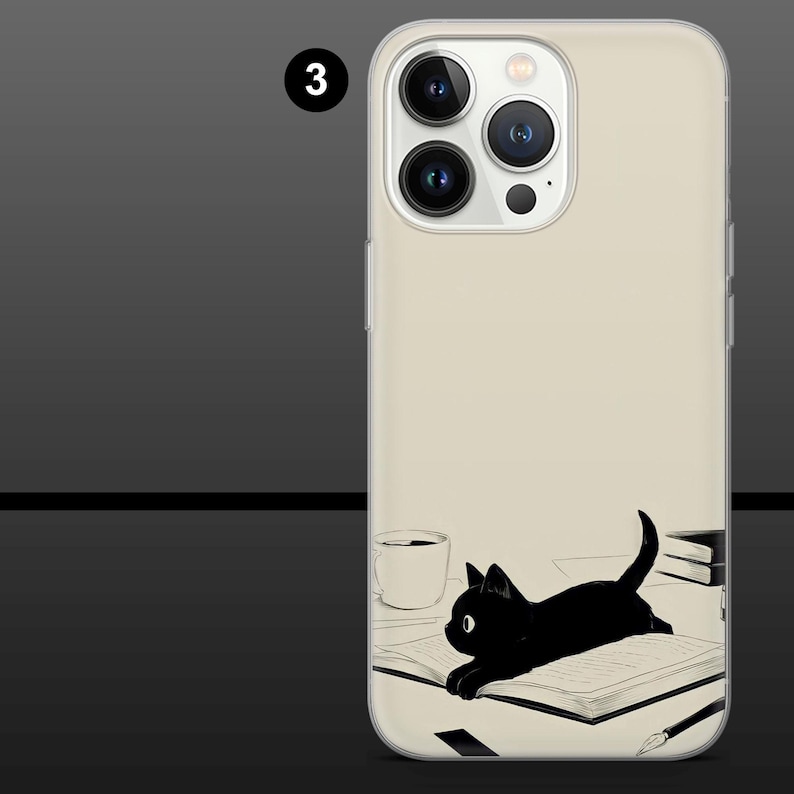 May include: A phone case featuring a black cat lying on an open book. The illustration is in black and white, with a coffee cup and a stack of books in the background. The case has a clear border.