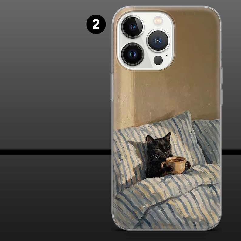 May include: A phone case featuring a painting of a black cat holding a coffee cup while sitting on a bed with blue and white striped pillows and a blanket. The background is a warm, neutral color.