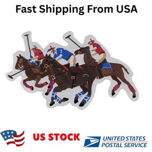 May include: Embroidered patch featuring three polo players on horseback in action. The players wear red, blue, and white uniforms. The horses are brown with blue leg wraps. The patch has the text "Fast Shipping From USA".
