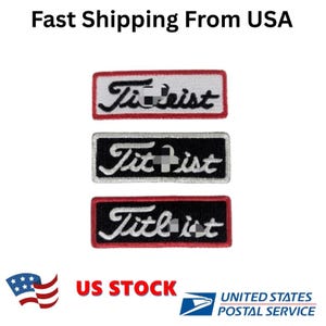 May include: Three embroidered patches with the word "Titleist" in white script. Each patch is rectangular with a black or white background and a red border. The top patch has a white background, the middle one is black, and the bottom one is black.