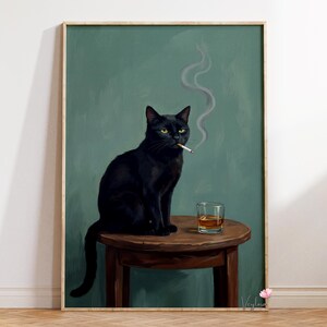 May include: A framed art print featuring a black cat with yellow eyes, smoking a cigarette, and sitting on a small wooden table. A glass of amber liquid sits on the table. The background is a muted teal color.