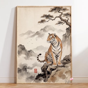 May include: A framed art print depicting a tiger in a traditional Japanese style. The tiger, with orange and black stripes, sits on a rocky outcrop, overlooking a misty mountain landscape. A tree and the text "虎守" are also visible.