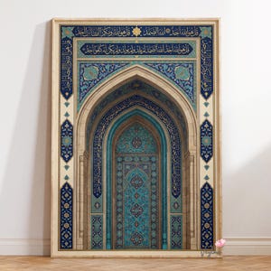 May include: Framed artwork featuring an arched doorway design with intricate blue and turquoise tile patterns. The artwork includes Arabic calligraphy and is set against a beige background, creating a detailed and ornate visual.