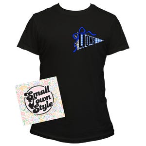 May include: Black t-shirt with a blue and white pennant design that reads "LIONS". The pennant is decorated with a blue bow and a gingham pattern. A floral card with the text "Small Town Style" is in the foreground.