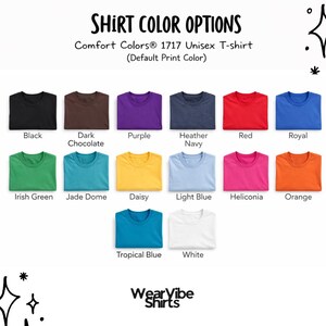 May include: A display of Comfort Colors 1717 unisex t-shirts in various colors, including black, dark chocolate, purple, heather navy, red, royal blue, Irish green, jade dome, daisy, light blue, heliconia, orange, tropical blue, and white. The text "SHIRT COLOR OPTIONS" is at the top.