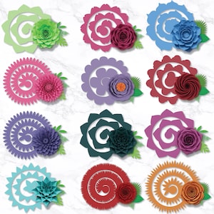 May include: A collection of colorful paper flowers in various designs. Each flower features a spiral or layered petal design, with accent flowers and green leaves. Colors include green, pink, blue, purple, red, and orange. The flowers are arranged on a white marble background.