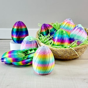 May include: A white ceramic mug with a black handle and the text "But First, Coffee" in a black, bold font. The mug is on a white surface.