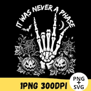 May include: A black graphic design featuring a white skeleton hand making a rock and roll gesture, surrounded by two jack-o'-lanterns, spiderwebs, a bat, and a crescent moon. The text IT WAS NEVER A PHASE is arched above the skeleton hand.