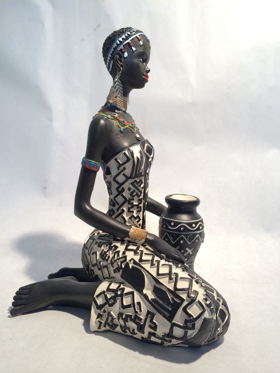 Sculpture of african woman holding a container, vivid pornstars hardcore