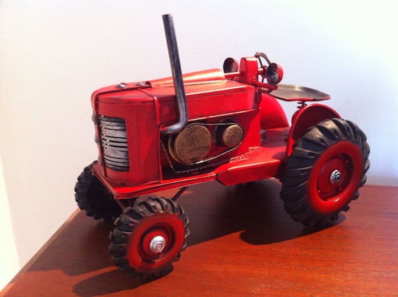 red metal tractor toy