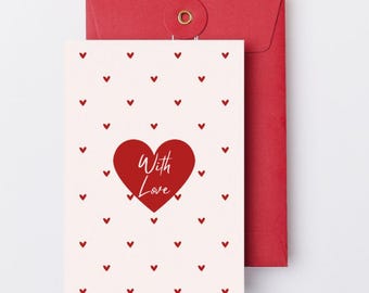 May include: A greeting card with a red heart that says "With Love" on a white background with small red hearts. The card is paired with a red envelope.