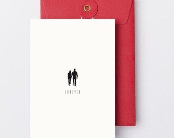 May include: A white greeting card with a black silhouette of a couple holding hands, with the word "FOREVER" below. The card is paired with a red envelope with a circular closure.