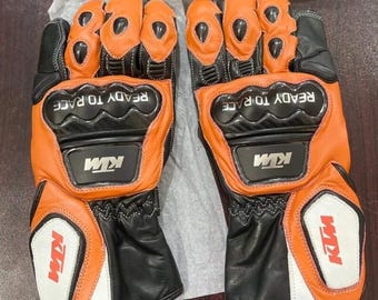 Skórzane rękawice motocyklowe KTM Racing – pomarańczowo-czarne, z włókna węglowego, chroniące kostki
