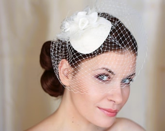 Ivory wedding birdcage veil with mini hat. Ivory bridal hair flowers