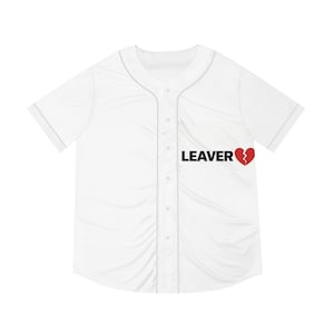 May include: White baseball jersey with short sleeves and a button-up front. The word "LEAVER" is printed in black, with a red broken heart graphic to the right.