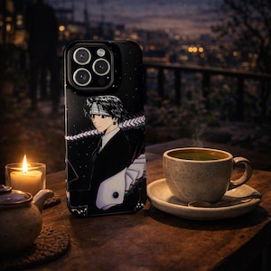 May include: Black phone case featuring an anime character design. The case is set on a wooden table with a lit candle, a teapot, and a cup of tea. The background shows a night scene with a starry sky.