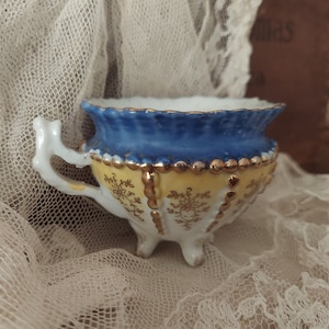 Antique Ornate Detailed Blue And Gold Footed Floral Tea Cup