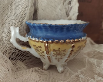 Antique Ornate Detailed Blue And Gold Footed Floral Tea Cup