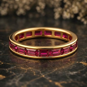 May include: A set of three ceramic mugs with a speckled, matte finish. The mugs are in cream, light grey, and dark grey. Each mug has a simple, minimalist design and a rounded handle.