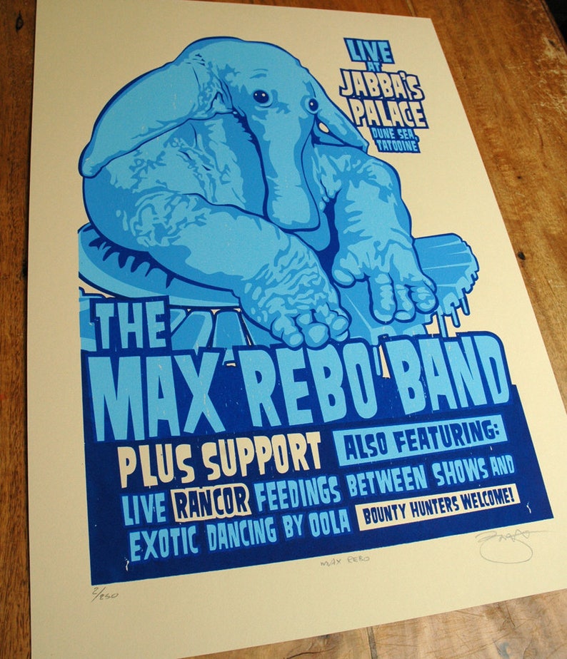 May include: A blue and white poster for The Max Rebo Band, featuring a large blue elephant-like creature. The poster advertises live music at Jabba's Palace, with additional acts and the text "Bounty Hunters Welcome!"