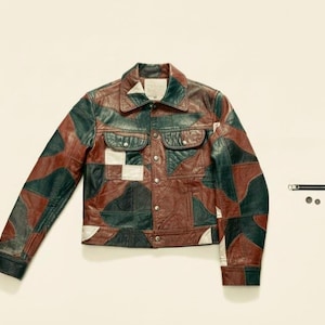 May include: A patchwork leather jacket in shades of brown, green, and white. The jacket has a collared neckline, button-down front, and two chest pockets. The design incorporates geometric shapes and patterns.