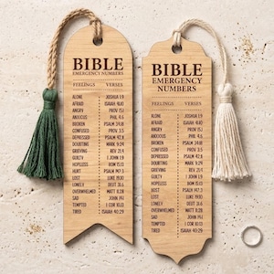May include: Two wooden Bible bookmarks with the text "Bible Emergency Numbers". Each bookmark has a tassel, one green and one cream-coloured. The bookmarks list feelings and corresponding Bible verses.